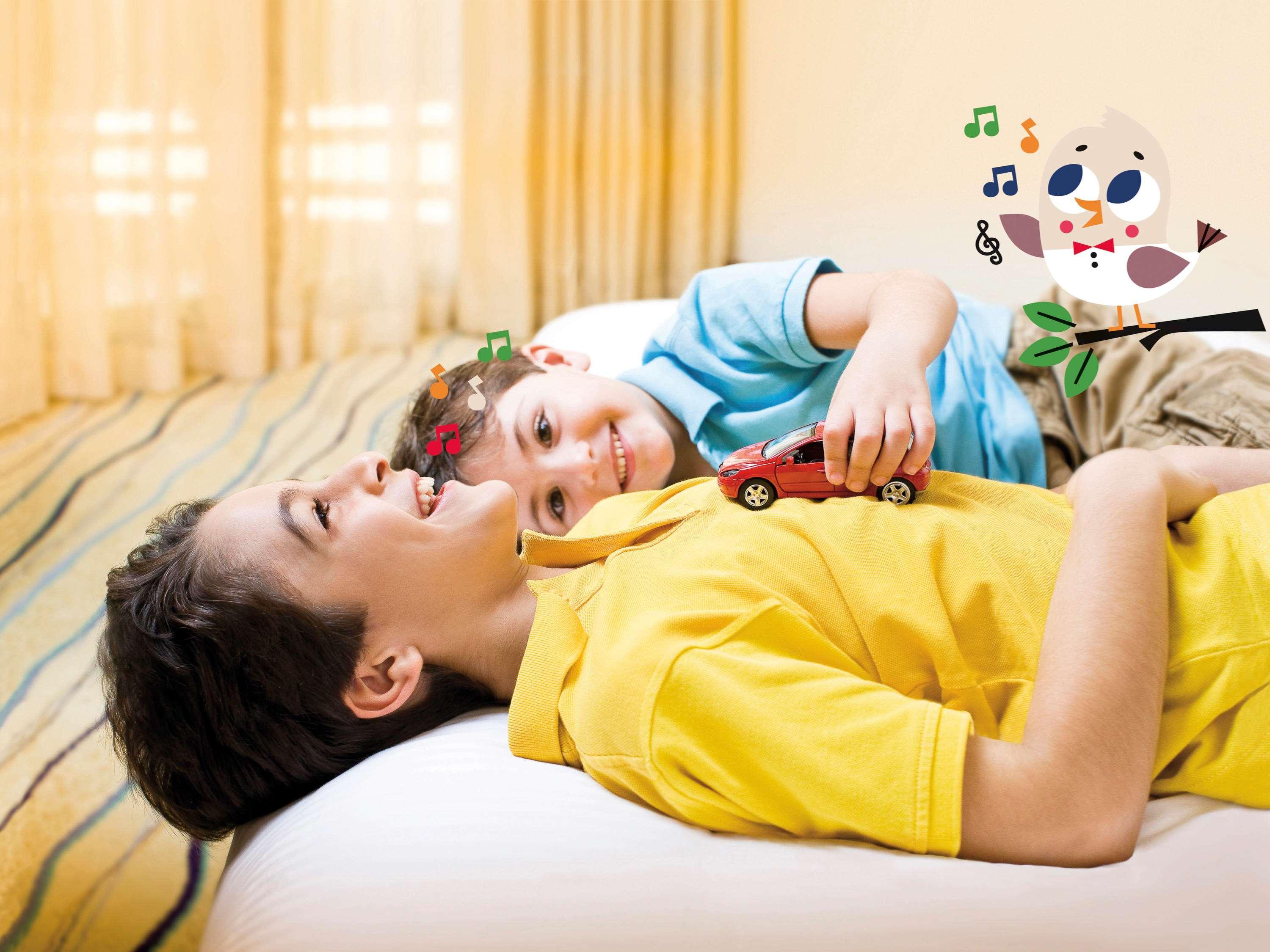 Moevenpick Hotel & Casino Malabata Tanger Ngoại thất bức ảnh A child with autism playing with a toy
